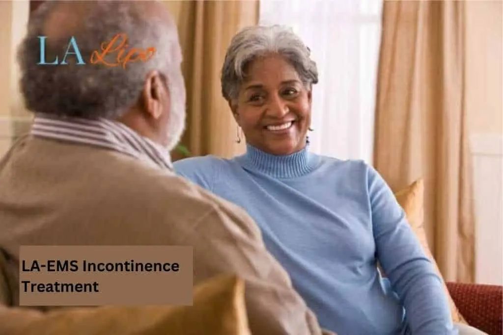 Couple sat smiling at each other - LA-EMS treatment Worthing